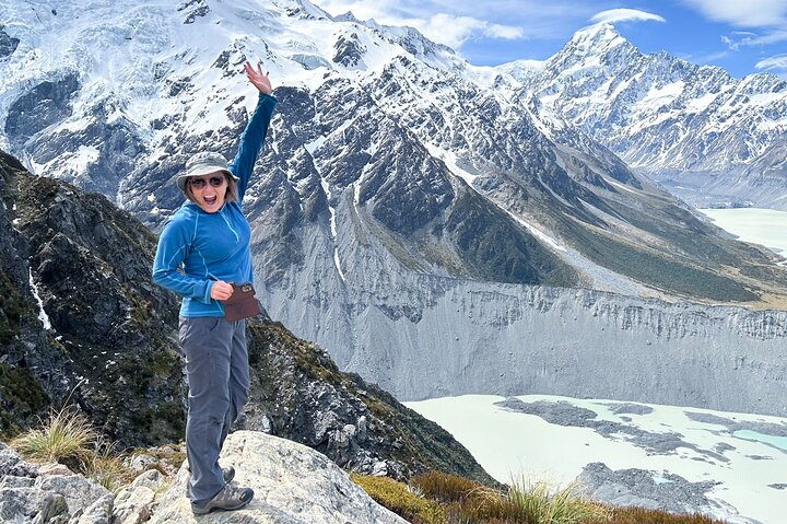 Woman hiker on snowy mountain trail